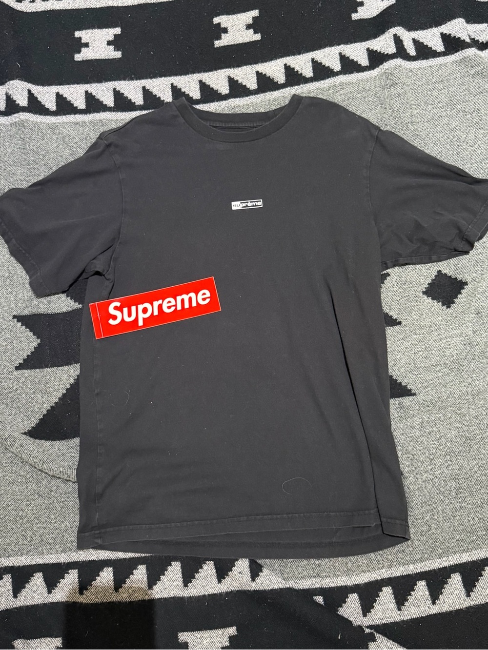 Supreme Black T-Shirt with Small Chest Logo and Red Box Sticker
